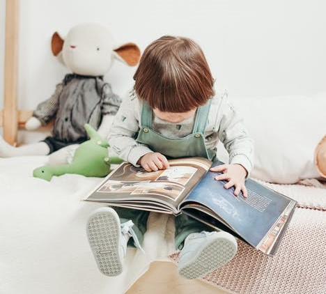 child reading book